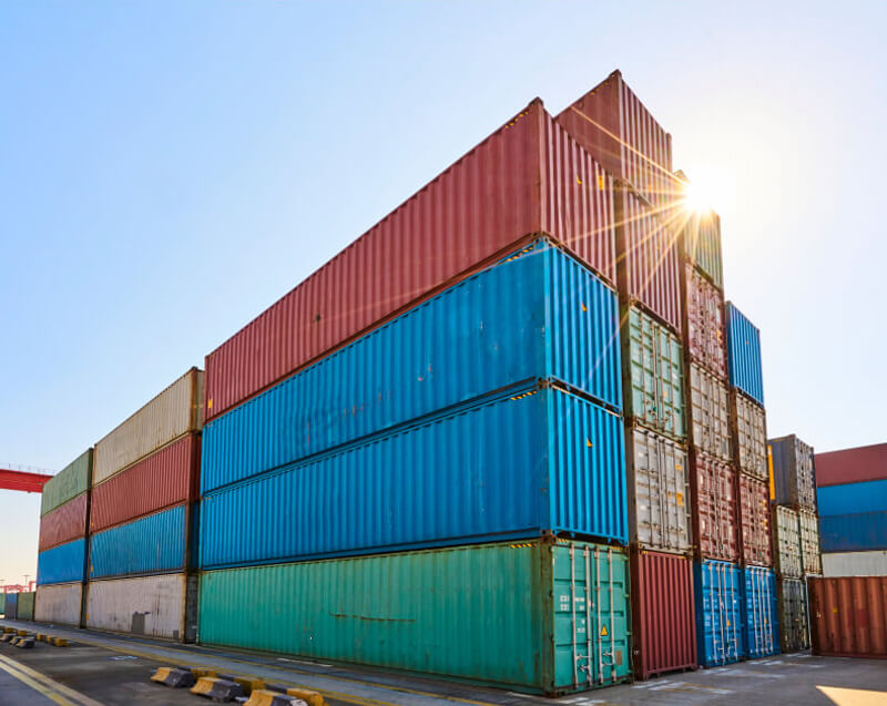 Stacked shipping containers ready for wholesale material transportation